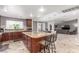 Open-concept kitchen with a large island, seating, and views into the adjacent living spaces at 3085 Duneville St, Las Vegas, NV 89146