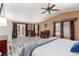 Bright and airy main bedroom with sitting area, ceiling fan, and abundant natural light at 3085 Duneville St, Las Vegas, NV 89146
