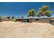 Expansive backyard with covered patio, privacy fence, and plenty of space for outdoor activities at 3090 Westwind Rd, Las Vegas, NV 89146
