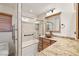 Bathroom featuring granite countertop, stylish sink, and a shower-tub combo, offering a functional and appealing design at 3090 Westwind Rd, Las Vegas, NV 89146
