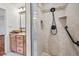 Modern bathroom with walk-in shower, glass enclosure, and tiled walls at 3090 Westwind Rd, Las Vegas, NV 89146
