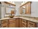 Bathroom showcasing wooden cabinets, granite countertop, and stylish sink, blending functionality with design at 3090 Westwind Rd, Las Vegas, NV 89146
