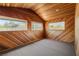 Bedroom featuring wooden walls, large windows, and recessed lighting at 3090 Westwind Rd, Las Vegas, NV 89146