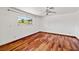 Bedroom with hardwood floors and a large window, offering a bright space at 3090 Westwind Rd, Las Vegas, NV 89146