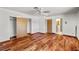Bedroom with hardwood floors and closet space, providing a simple design and seamless transitions to other rooms at 3090 Westwind Rd, Las Vegas, NV 89146