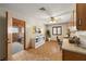 Bright room with wood-look floors, ceiling fan, and adjacent bedroom at 3090 Westwind Rd, Las Vegas, NV 89146