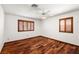 Bedroom featuring beautiful hardwood floors, natural light from windows, and closet for storage at 3090 Westwind Rd, Las Vegas, NV 89146