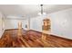 Spacious living room boasts hardwood flooring, a fireplace, and seamless transitions to the dining and kitchen areas at 3090 Westwind Rd, Las Vegas, NV 89146