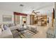 Open-concept living room featuring an adjacent kitchen, and sliding glass doors to the outdoor living space at 3090 Westwind Rd, Las Vegas, NV 89146