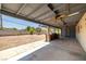 Spacious covered patio featuring ceiling fans and a built-in outdoor kitchen with BBQ at 3090 Westwind Rd, Las Vegas, NV 89146