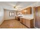 Room with wood-look floors and oak cabinetry at 3090 Westwind Rd, Las Vegas, NV 89146