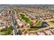 Aerial view of the community showcases a golf course, lakes, and single-Gathering homes at 3101 Hayden Ct, Las Vegas, NV 89134