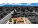Aerial view of a single-Gathering home in a residential neighborhood with mountain views in the distance at 317 Kane Ave, Las Vegas, NV 89110