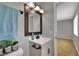 Updated bathroom featuring a modern vanity and a stylish mirror at 317 Kane Ave, Las Vegas, NV 89110