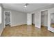 A spacious bedroom features tile flooring, neutral walls, and includes closet space at 317 Kane Ave, Las Vegas, NV 89110