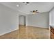 Dining area with a ceiling fan, tile flooring, and a large window at 317 Kane Ave, Las Vegas, NV 89110