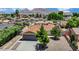 The home boasts a well-maintained front yard with desert landscaping and a two-car garage at 317 Kane Ave, Las Vegas, NV 89110