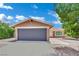 Charming single-story home featuring a two-car garage and landscaped yard at 317 Kane Ave, Las Vegas, NV 89110