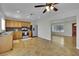 Open concept kitchen with stainless steel appliances and adjacent living area at 317 Kane Ave, Las Vegas, NV 89110