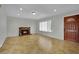 Bright living room with fireplace, tile flooring, recessed lighting, and front door at 317 Kane Ave, Las Vegas, NV 89110