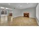Open concept living area with tile flooring, recessed lights and brick fireplace at 317 Kane Ave, Las Vegas, NV 89110
