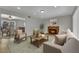Comfortable living room with a brick fireplace and access to the dining area at 317 Kane Ave, Las Vegas, NV 89110