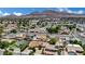 The neighborhood showcases mature trees and diverse home styles, set against a backdrop of mountains at 317 Kane Ave, Las Vegas, NV 89110