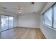 Spacious room featuring sliding glass doors and large windows at 3785 Decade St, Las Vegas, NV 89121