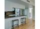 Bright eat-in kitchen with breakfast bar and stainless steel appliances at 3785 Decade St, Las Vegas, NV 89121