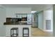 Bright kitchen features stainless steel appliances, a breakfast bar with seating, and sleek countertops at 3785 Decade St, Las Vegas, NV 89121