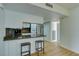 Bright kitchen features stainless steel appliances, a breakfast bar with seating, and sleek countertops at 3785 Decade St, Las Vegas, NV 89121