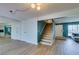 Spacious room with wooden floors and a view to the stairs and to the kitchen at 3785 Decade St, Las Vegas, NV 89121