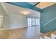 Light-filled living room with hardwood floors and sliding glass doors to the exterior at 3785 Decade St, Las Vegas, NV 89121
