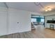 Large living room with wooden floors, and a view to the kitchen and living room at 3785 Decade St, Las Vegas, NV 89121