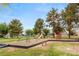 Charming community playground with various play structures under mature trees in a Gathering-friendly neighborhood at 3785 Decade St, Las Vegas, NV 89121