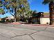 Apartment complex showcasing mature trees, sidewalks, and desert landscaping at 3911 Torsby Pl, Las Vegas, NV 89119