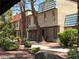 Exterior of a multi-Gathering home featuring desert landscaping, sidewalk, and multiple units at 3911 Torsby Pl, Las Vegas, NV 89119