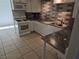 Well-lit kitchen with modern appliances, stylish countertops, and a subway-tile backsplash at 3911 Torsby Pl, Las Vegas, NV 89119