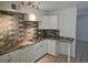 Well-lit kitchen features modern countertops, stainless steel appliances, and sleek cabinetry at 3911 Torsby Pl, Las Vegas, NV 89119