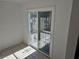 Bright living room with sliding glass door and security bars at 3911 Torsby Pl, Las Vegas, NV 89119