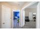 Hallway offering a view into the bedrooms which include soft carpet and bright paint at 433 Jubilation Dr, Las Vegas, NV 89145