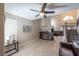Spacious living area featuring a fireplace, staircase, and tile flooring, ideal for comfortable living and entertaining at 433 Jubilation Dr, Las Vegas, NV 89145
