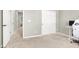 Spacious carpeted bedroom featuring closet and open doorway with a modern desk in the corner at 4533 Queens Hill St, North Las Vegas, NV 89031