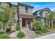 Inviting home exterior with landscaped yard and a charming walkway to the front door at 4533 Queens Hill St, North Las Vegas, NV 89031