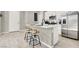 The kitchen features a large island with bar stools and modern appliances at 4533 Queens Hill St, North Las Vegas, NV 89031