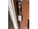 Close-up of a lockbox attached to a door, commonly used for property access at 4533 Queens Hill St, North Las Vegas, NV 89031