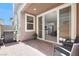 Outdoor patio with stone pavers and an air conditioning unit with sliding doors leading to home's interior at 4533 Queens Hill St, North Las Vegas, NV 89031