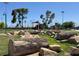 Unique recreational area featuring boulder logs and stone seating, perfect for outdoor leisure and scenic enjoyment at 4533 Queens Hill St, North Las Vegas, NV 89031