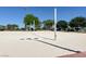 Sandy volleyball court with well-maintained nets and clear skies, offering a fun outdoor recreation space at 4533 Queens Hill St, North Las Vegas, NV 89031
