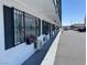 Close-up view of a white building with black shutters, window bars, and flower boxes under the windows at 4600 Paradise Rd # 16, Las Vegas, NV 89169